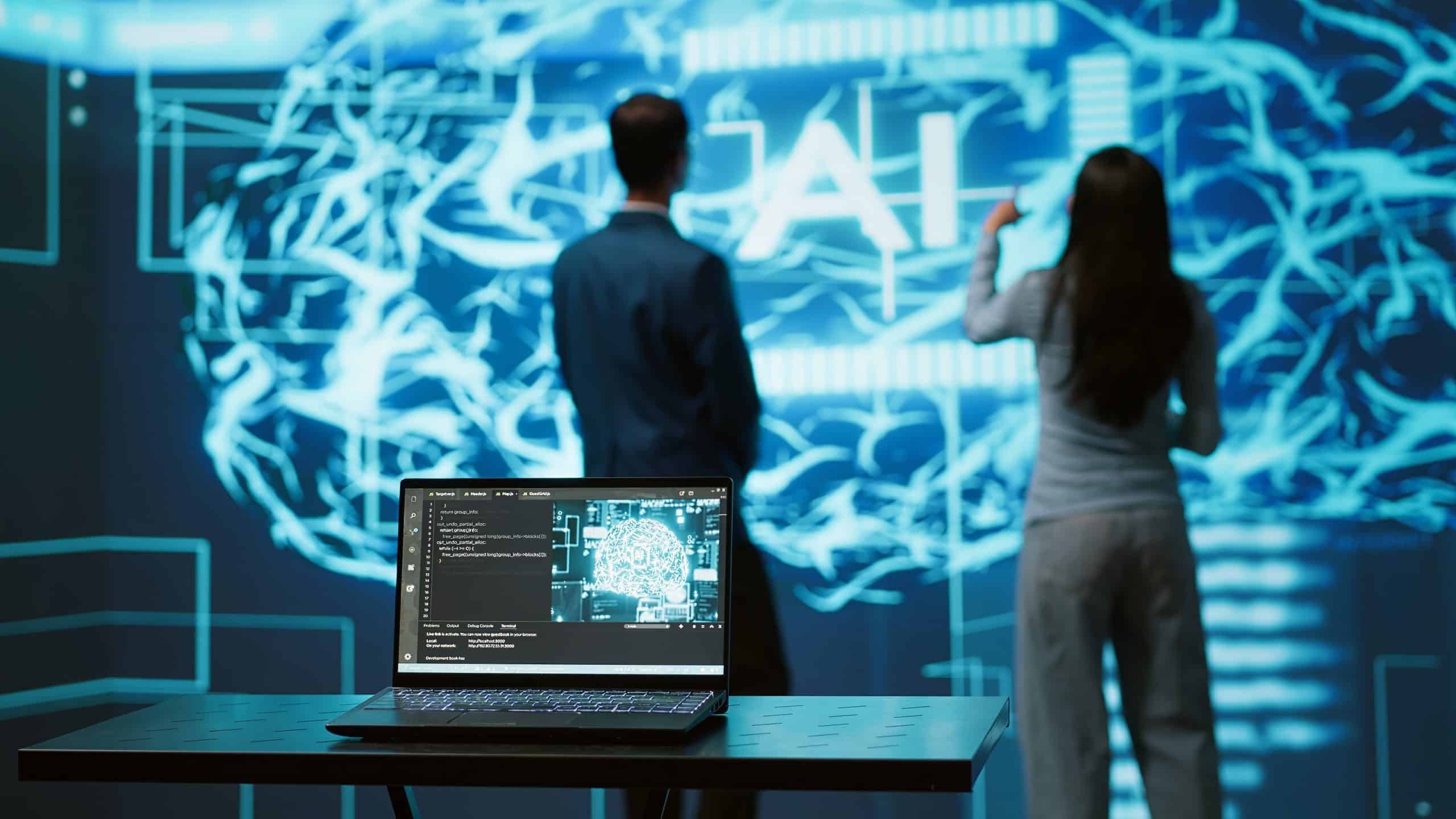 AI research team analyzing data on laptop