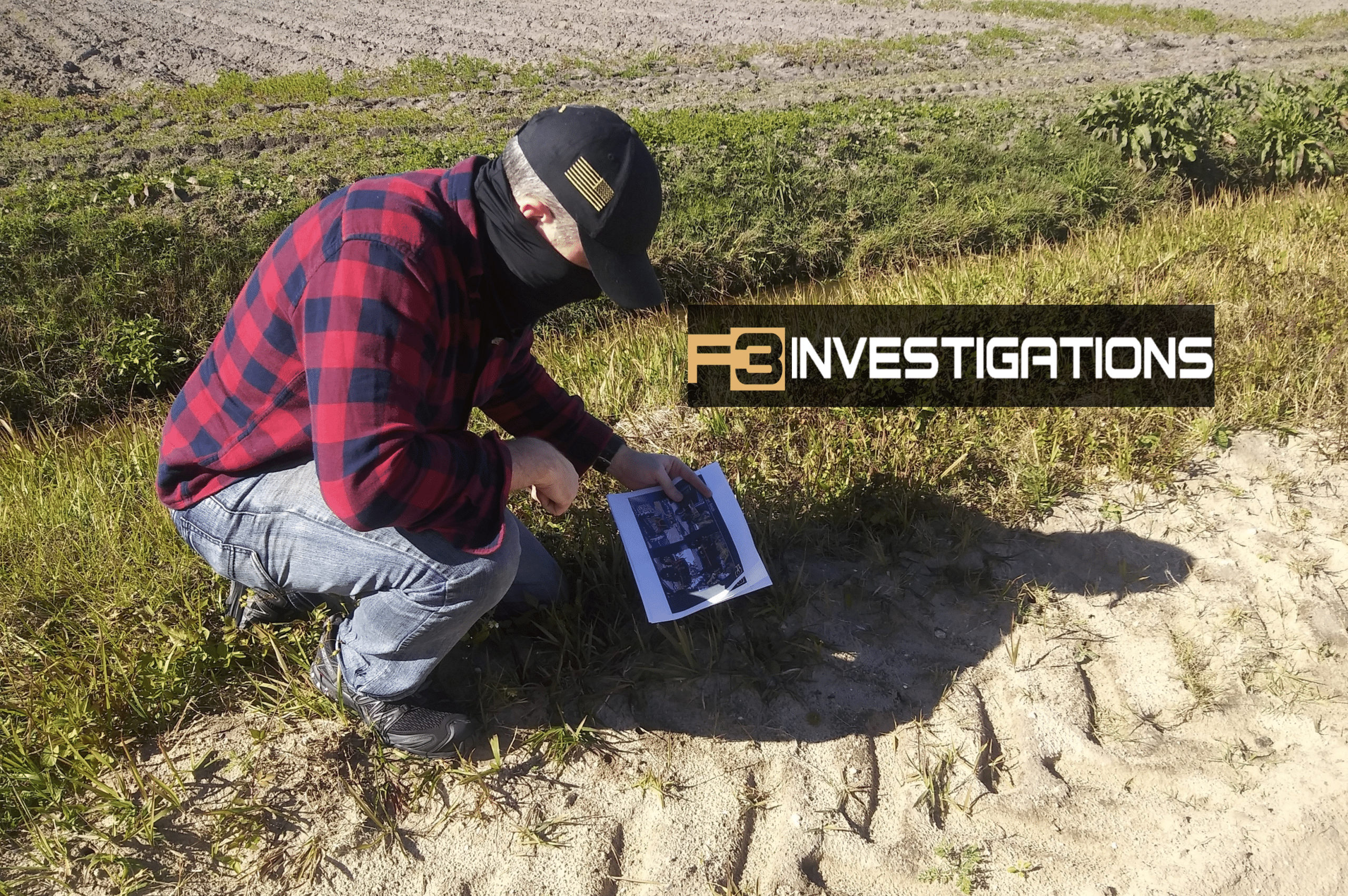Investigator examines field evidence, wearing plaid shirt.