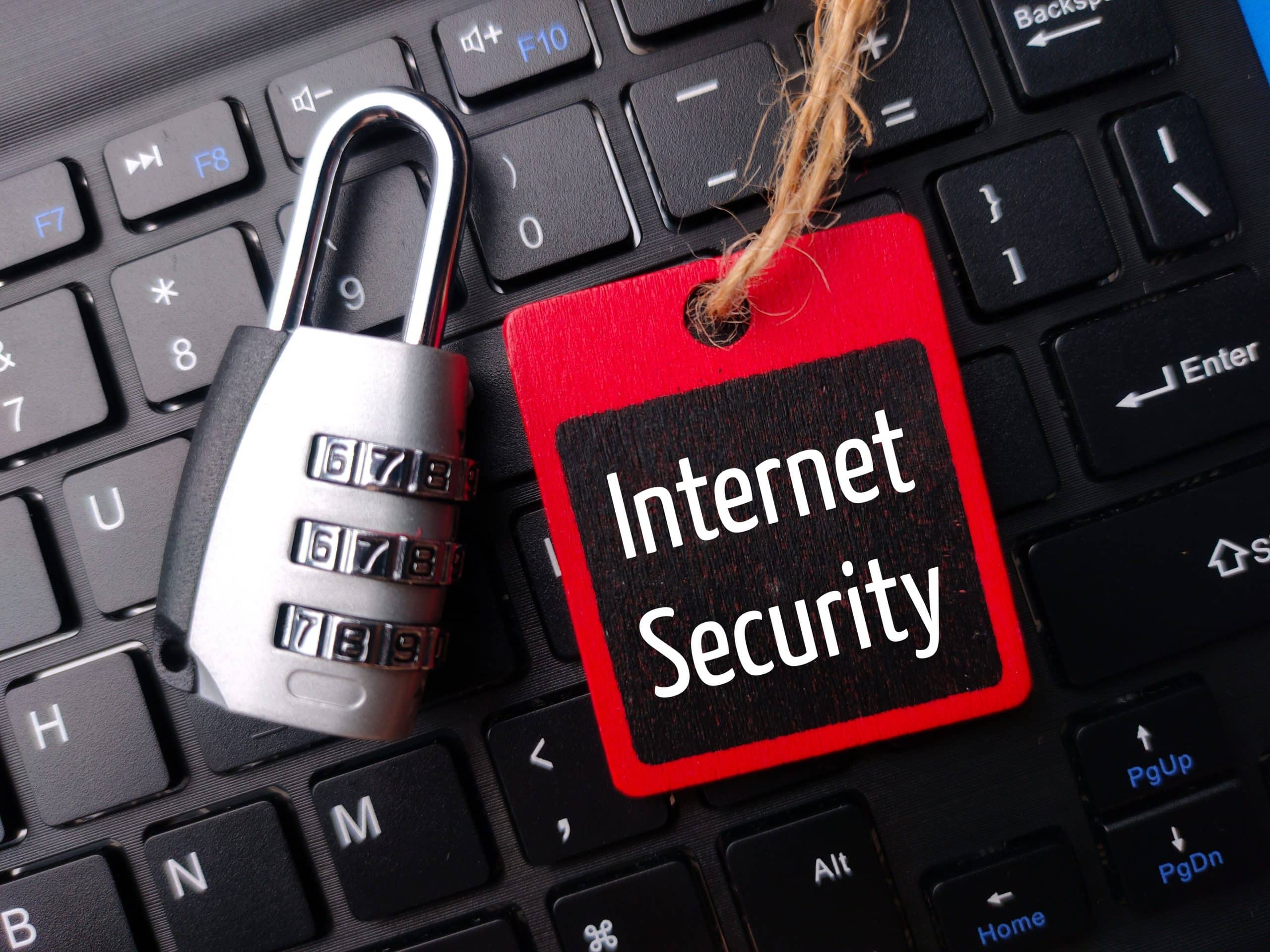 Lock with Internet Security tag on keyboard.
